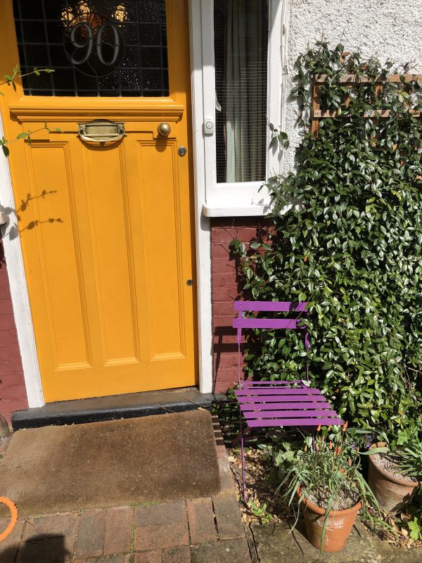 cottage garden seating outside the front door of a London house